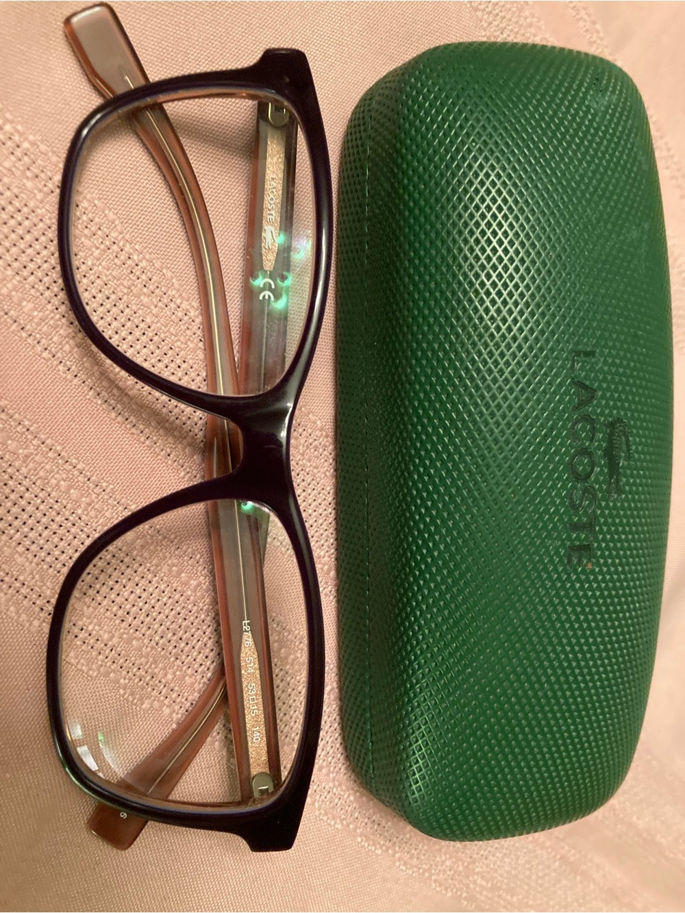 Lacoste eyeglasses Eggplant w/Lavender Lacoste logo and trim.